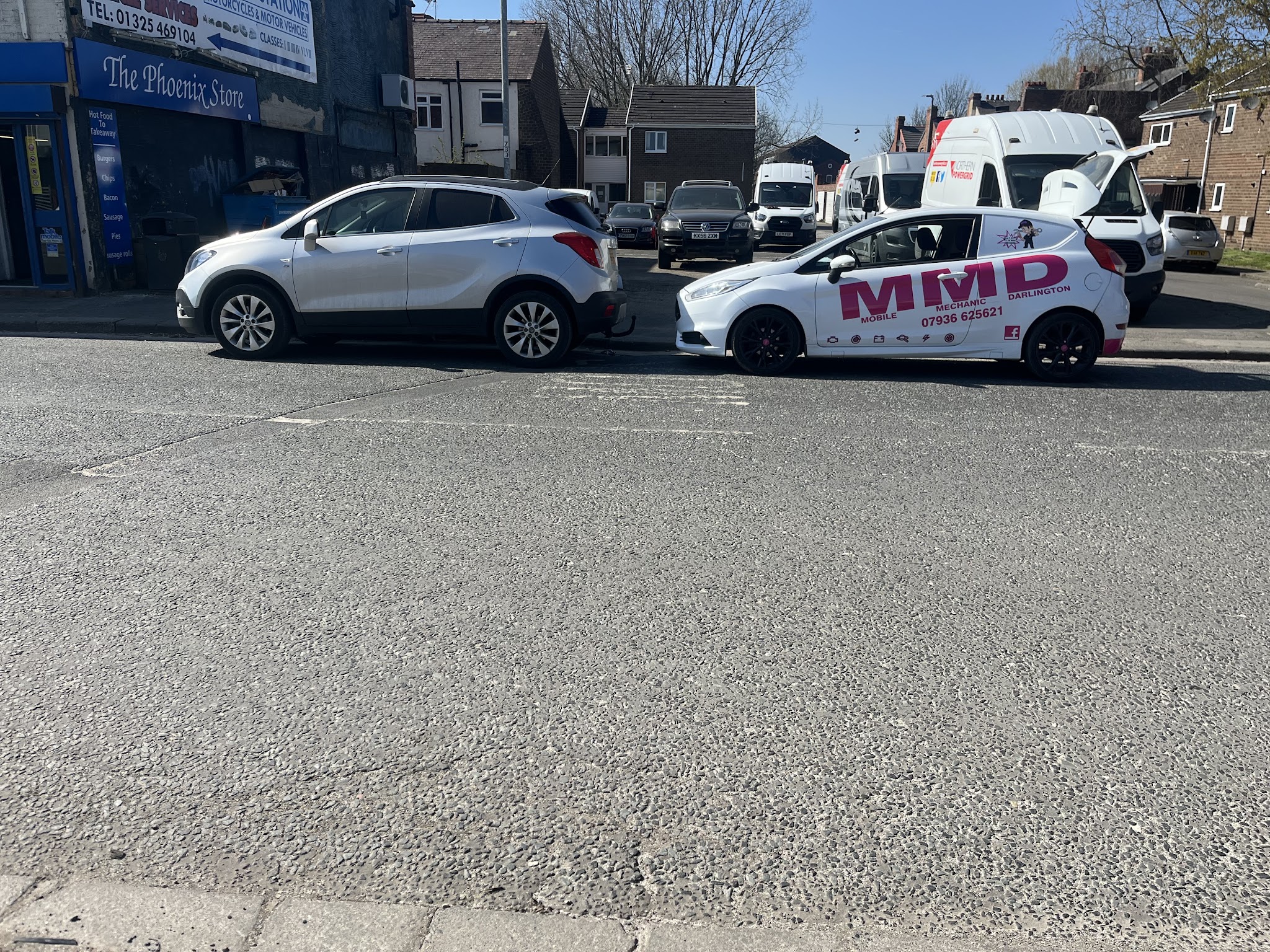 MMD van and a customer's car on a Darlington street