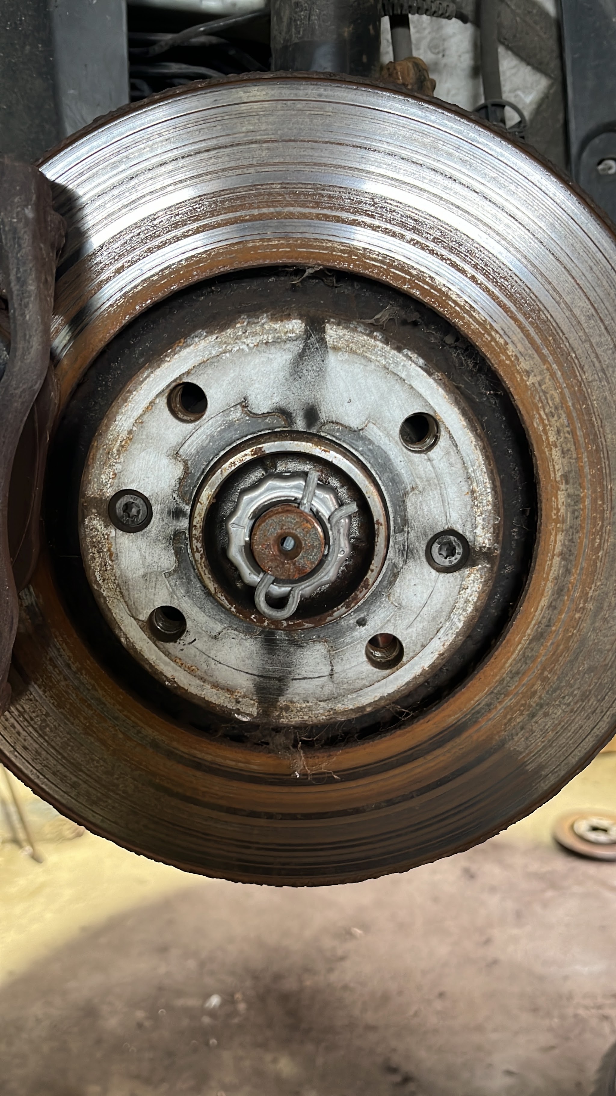 Brake disc and hub exposed during a repair